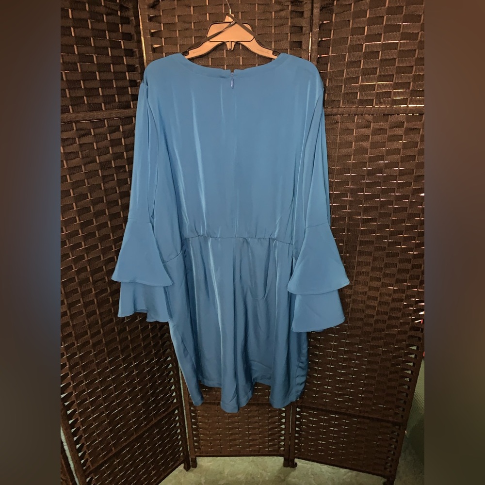 Blue shorts romper with ruffle sleeves. Perfect for a night out or get together.